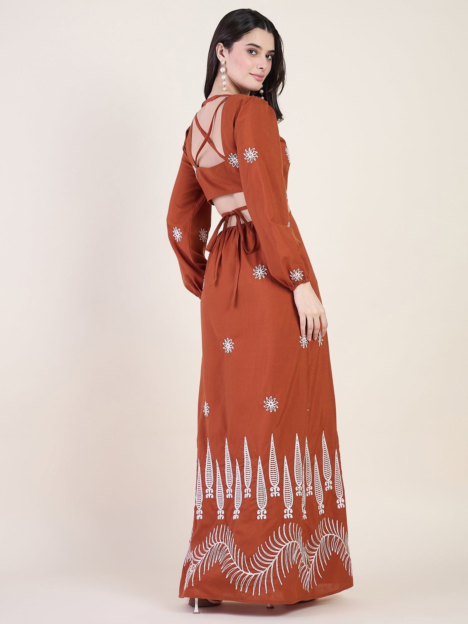 Embroidered maxi dress with floral charm in rust colour