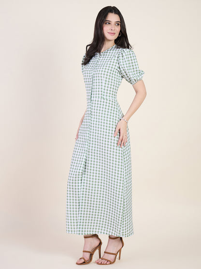 Woman wearing a green checkered dress on a beige background