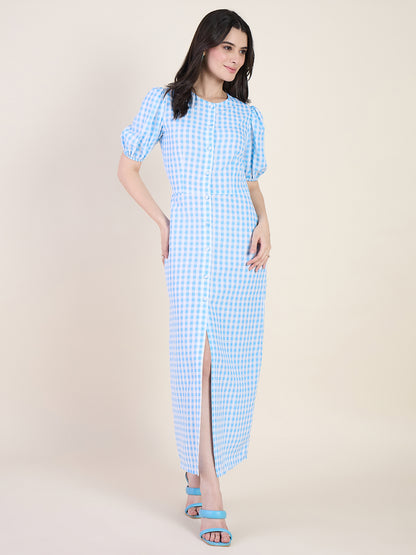 Woman wearing a blue checkered dress on a beige background