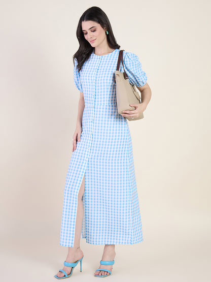 Woman wearing a blue checkered dress on a beige background