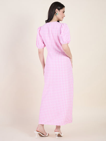 Woman wearing a pink checkered dress on a beige background