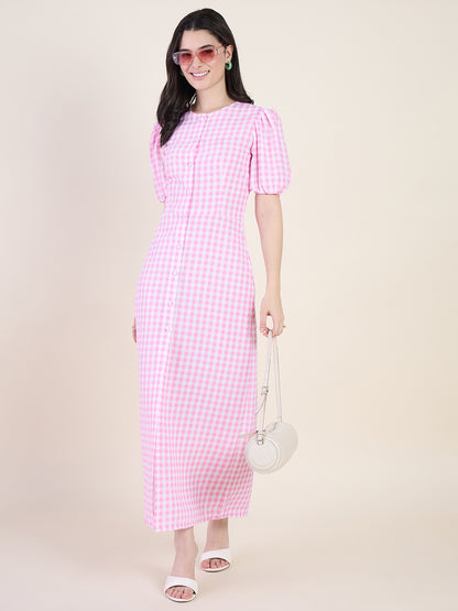Woman wearing a pink checkered dress on a beige background