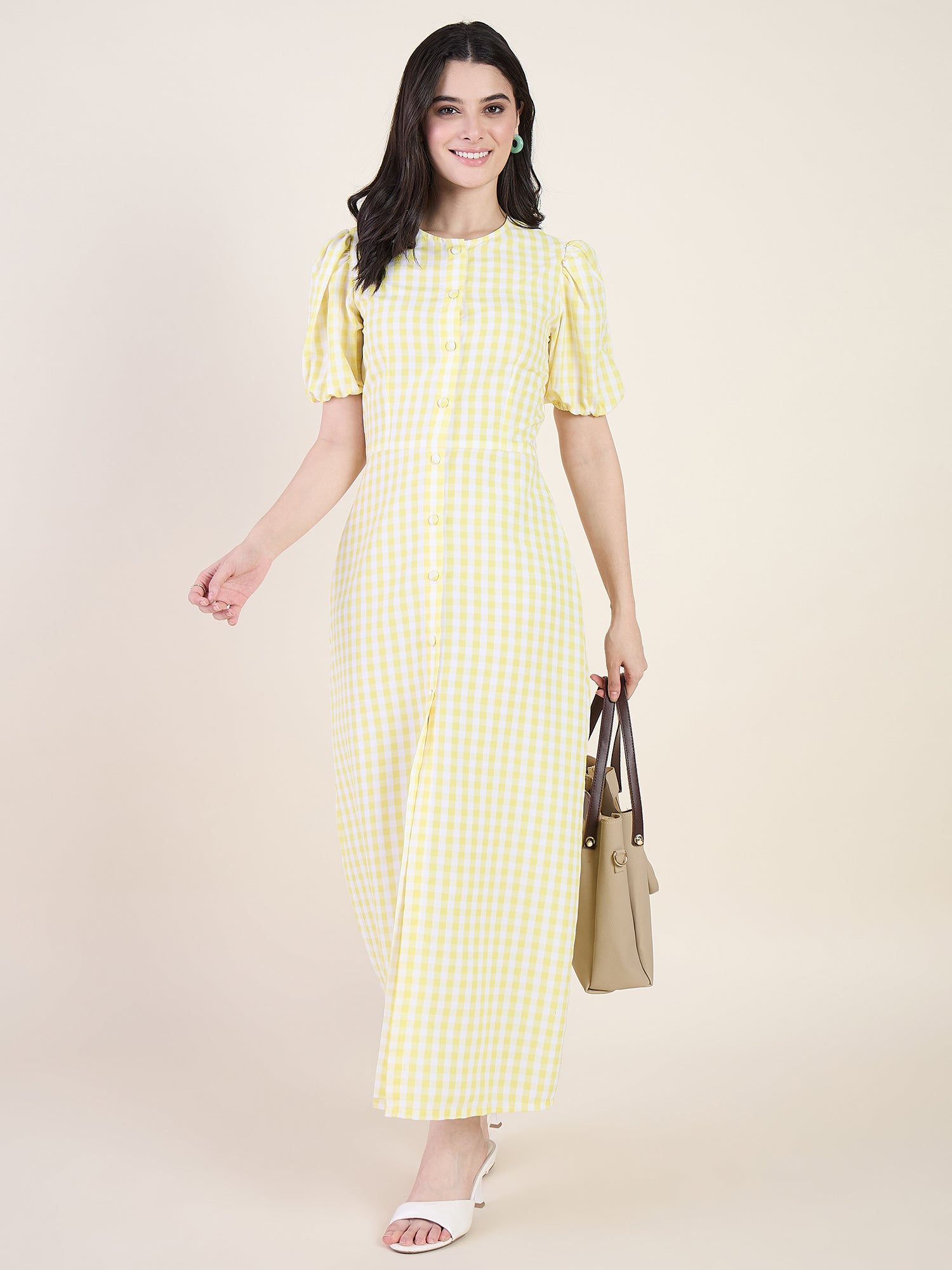 Woman wearing a yellow checkered dress on a beige background