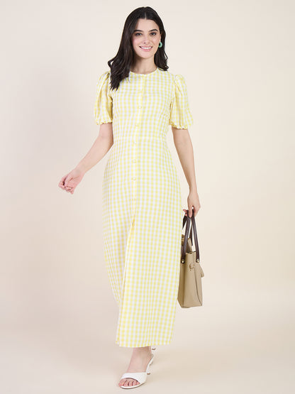 Woman wearing a yellow checkered dress on a beige background