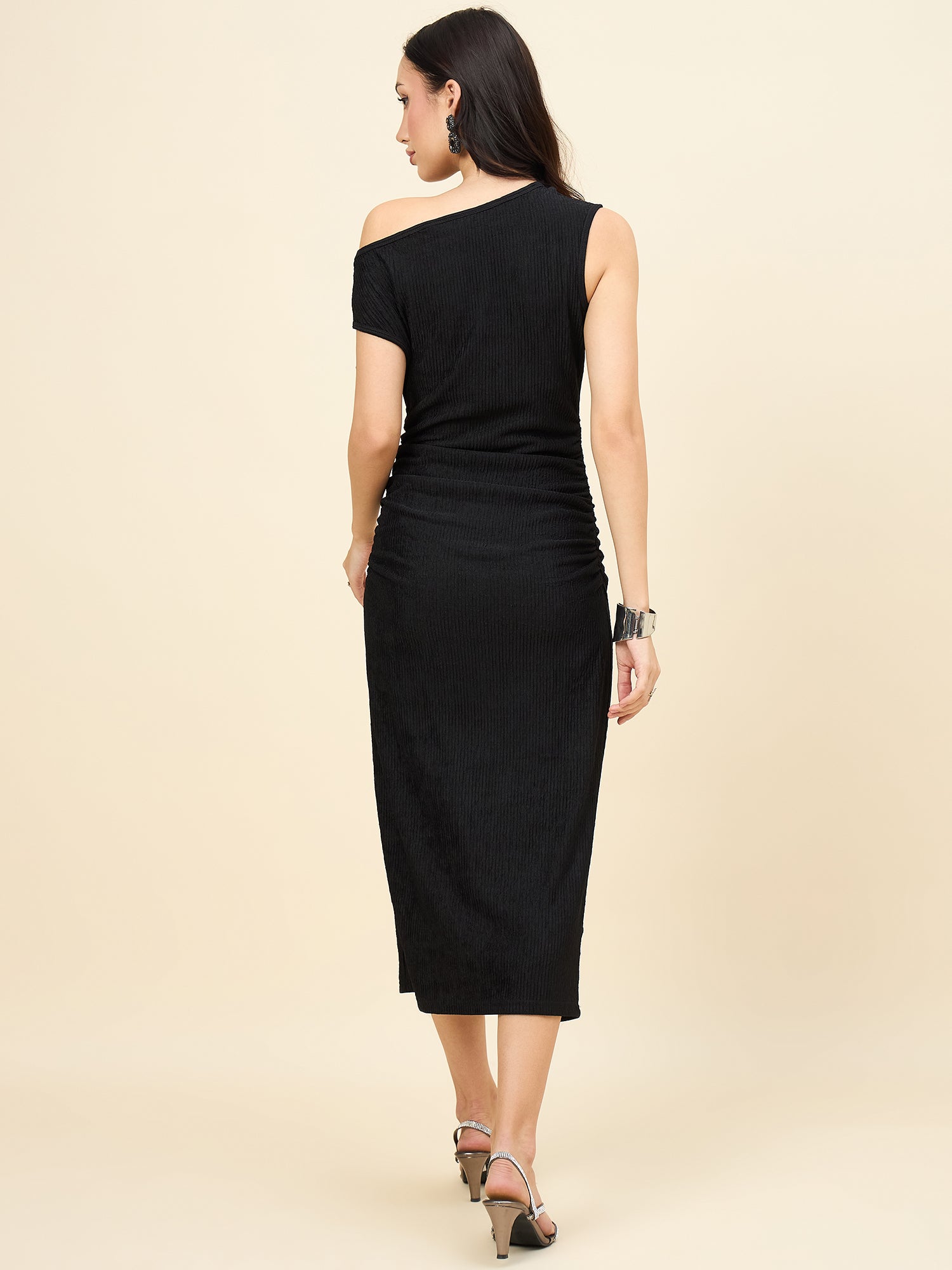 one-shoulder bodycon black midi on pink background