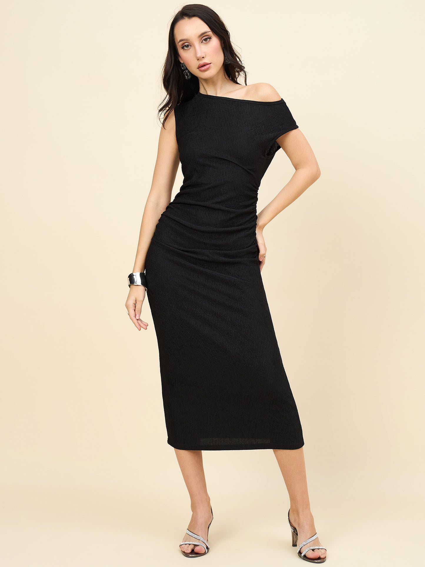 one-shoulder bodycon black midi on pink background