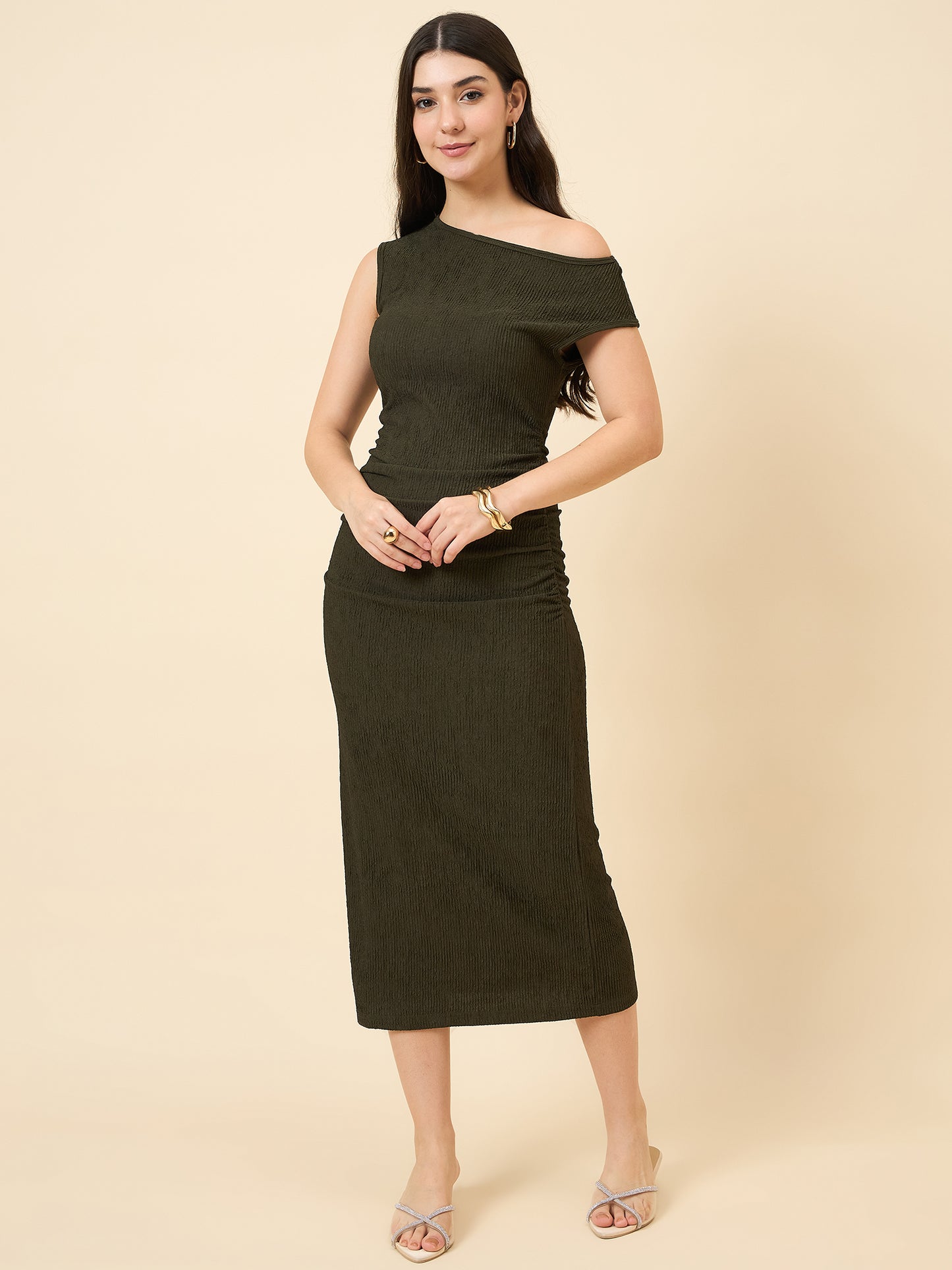 one-shoulder bodycon green midi on pink background