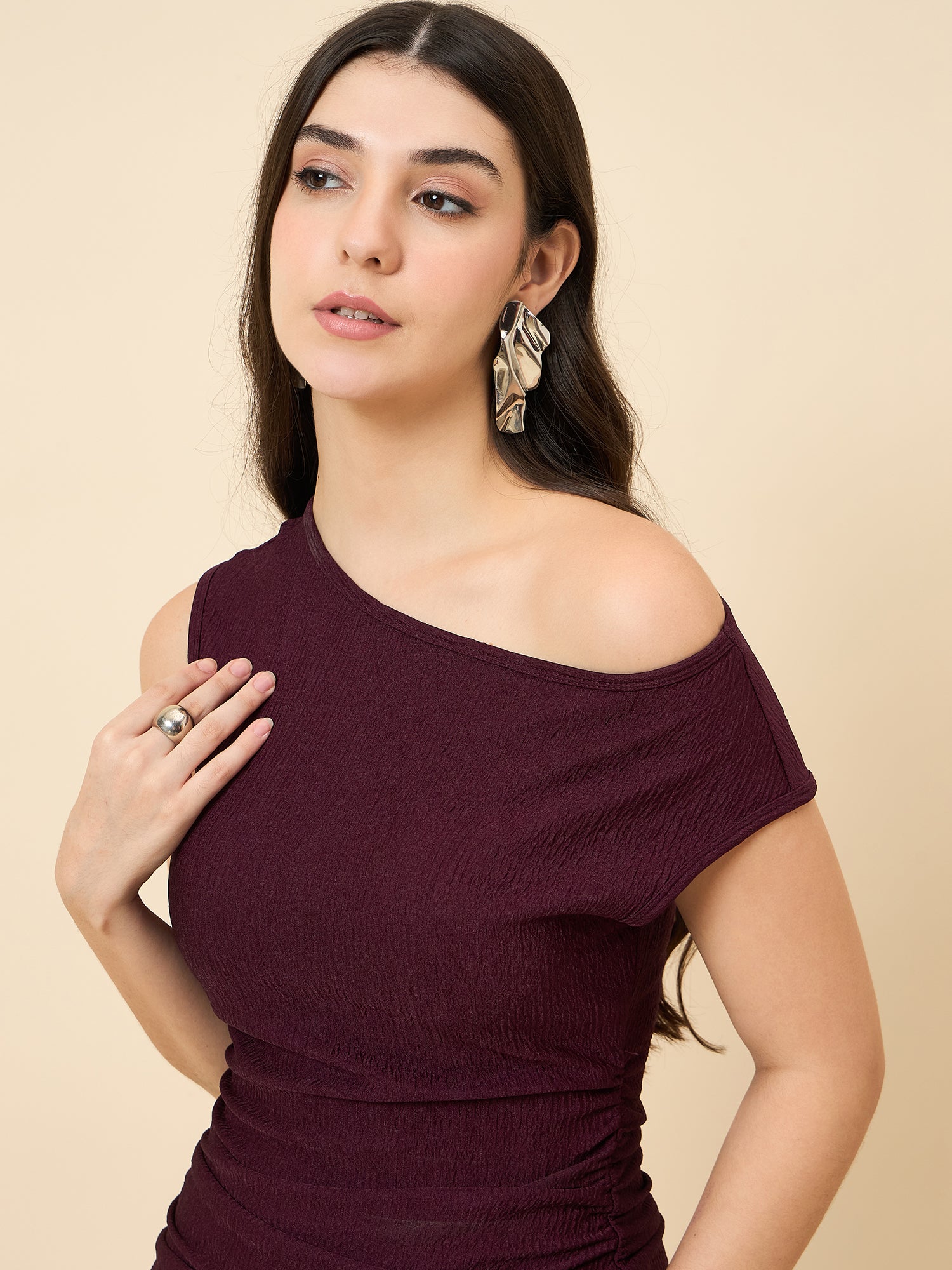one-shoulder bodycon wine midi on pink background