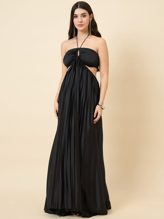 Woman wearing a black halter neck gown on a beige background