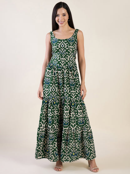 Woman wearing a green patterned dress on a white background