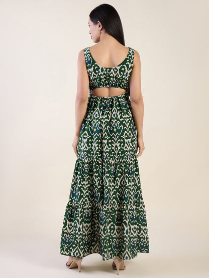 Woman wearing a green patterned dress on a white background