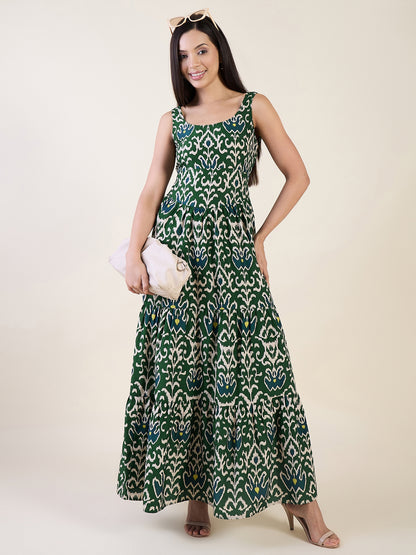 Woman wearing a green patterned dress on a white background