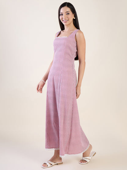 Woman wearing a pink sleeveless dress on a white background