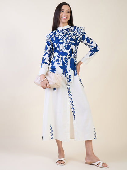 Woman wearing a blue and white floral dress on a plain background