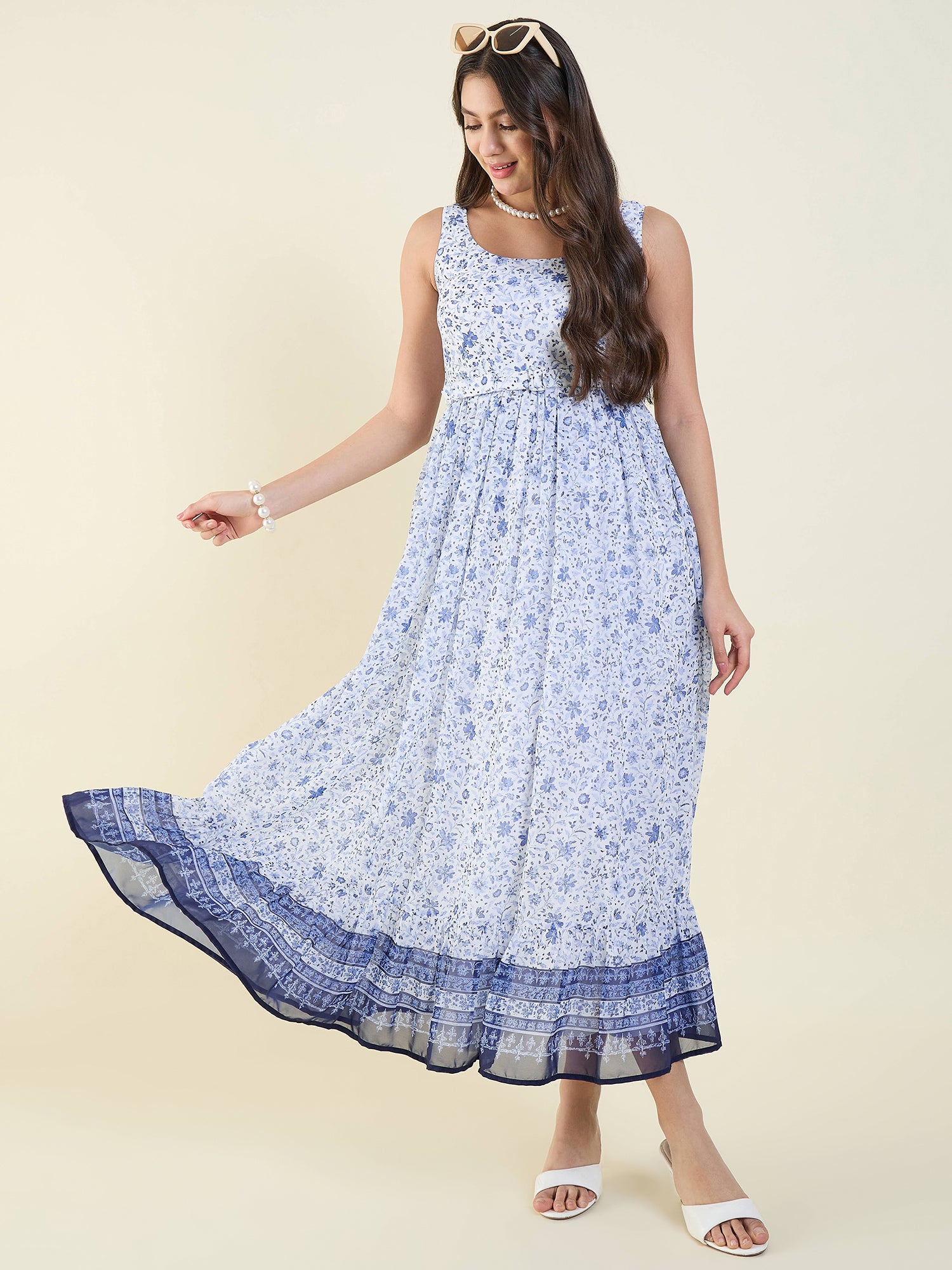 Woman wearing a blue floral dress on a beige background