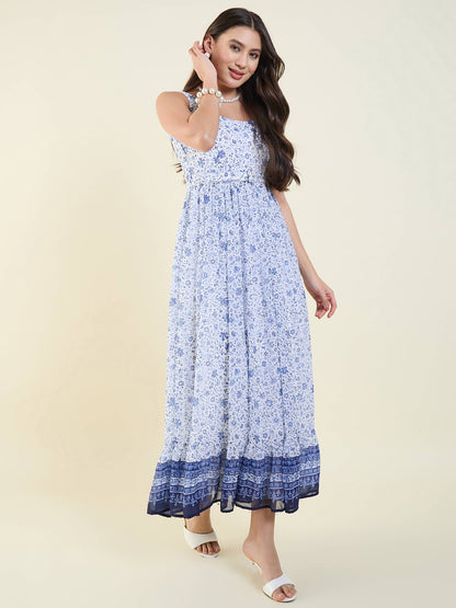 Woman wearing a blue floral dress on a beige background
