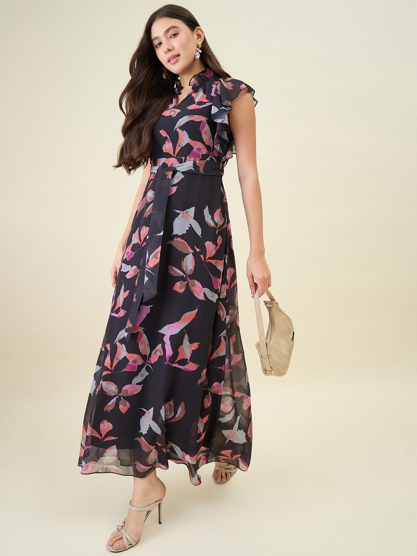 Woman wearing a floral dress with a plain background