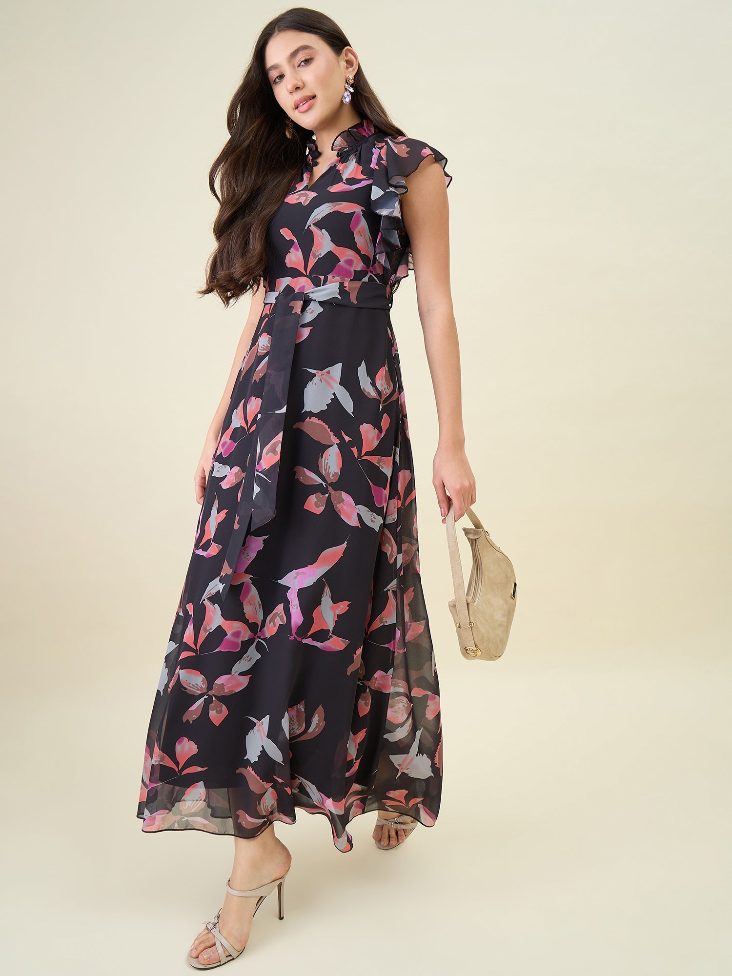 Woman wearing a floral dress with a plain background