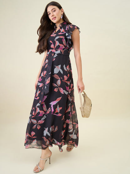 Woman wearing a floral dress with a plain background