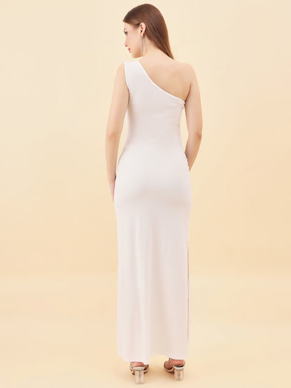 Woman wearing a white one-shoulder dress against a beige background