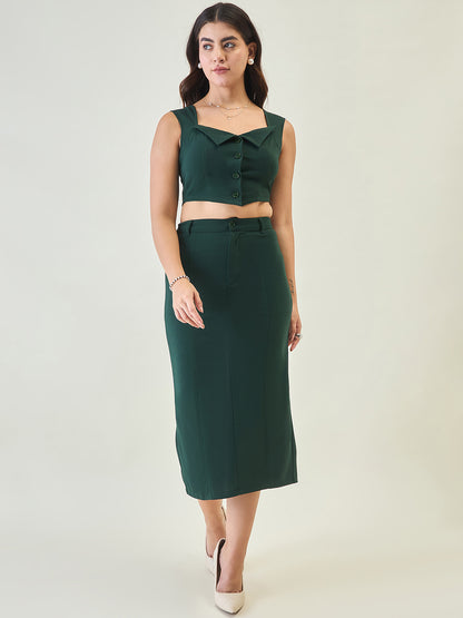 Woman wearing a green sleeveless top and skirt set on a white background