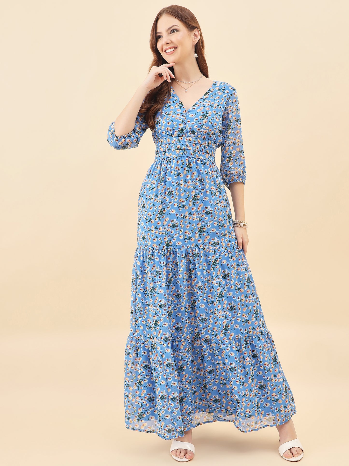 Woman wearing a blue floral dress on a beige background