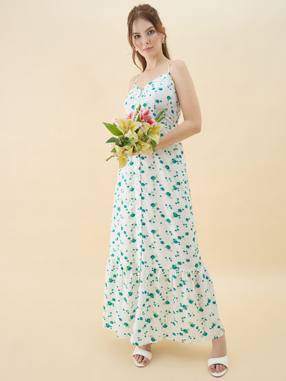 Woman in a floral dress holding flowers against a beige background