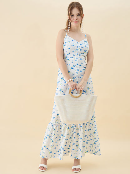 Woman in a floral dress holding a woven bag against a beige background