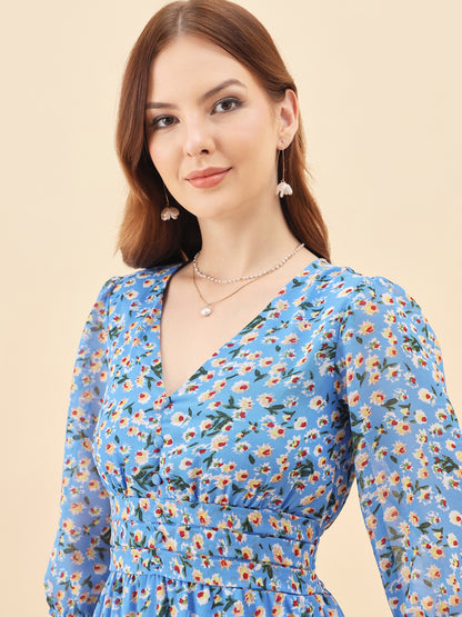 Woman wearing a blue floral dress against a beige background