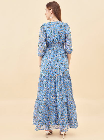 Woman wearing a blue floral dress on a beige background