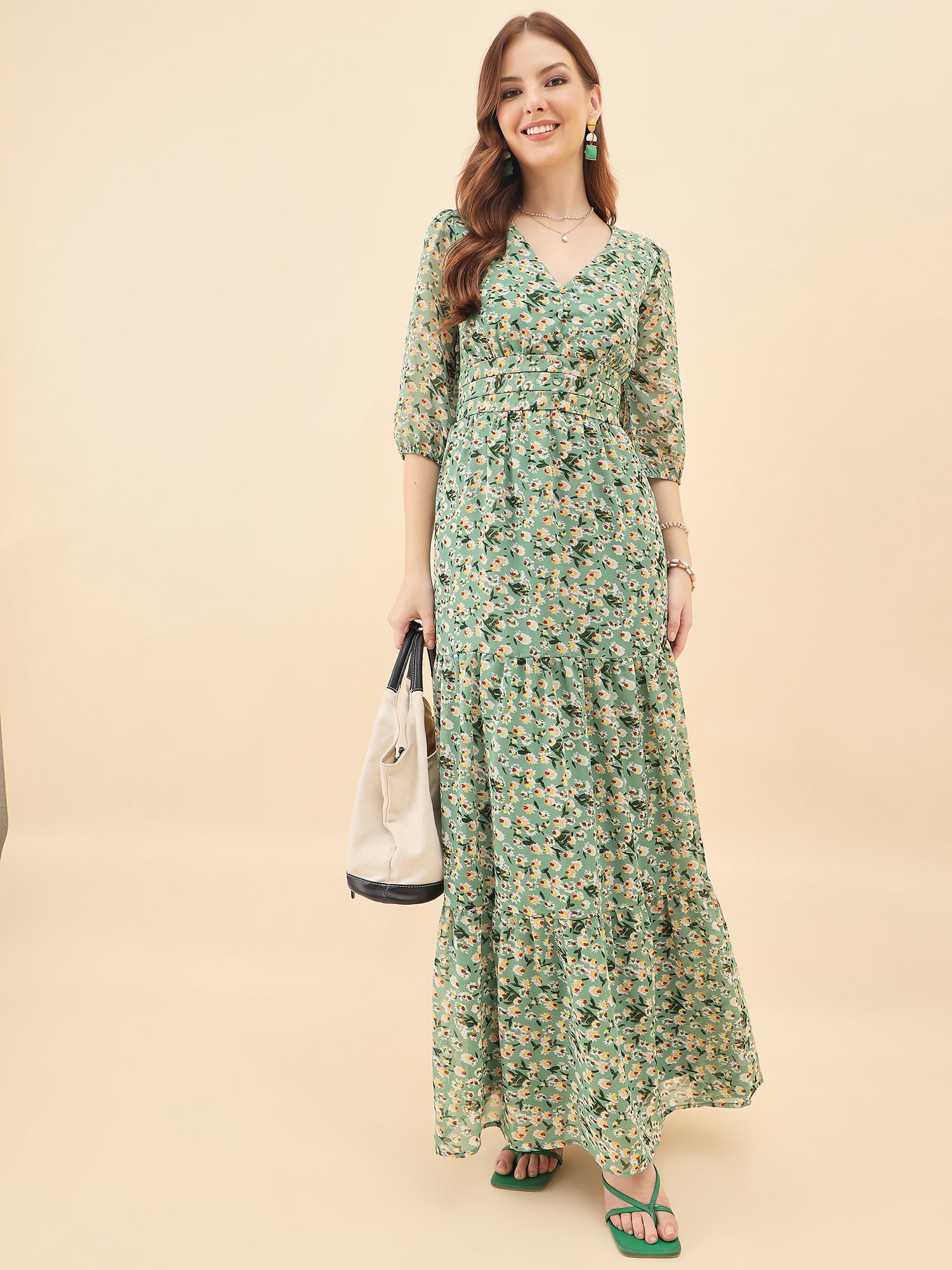Woman wearing a green floral dress against a beige background