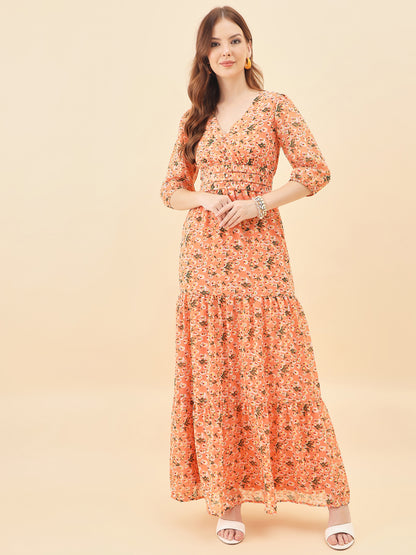 Woman wearing a Orange floral dress on a beige background