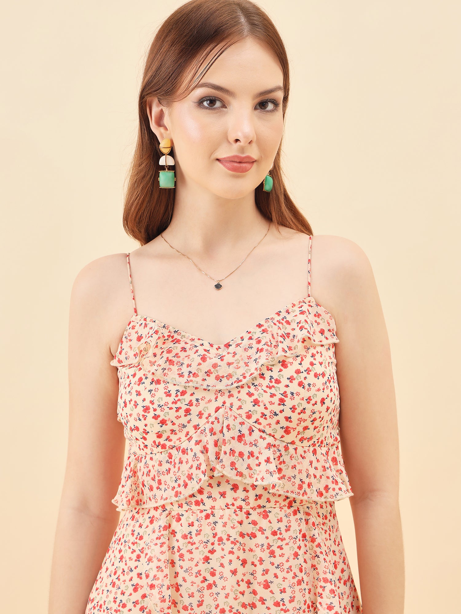 Woman wearing a floral dress with a plain background