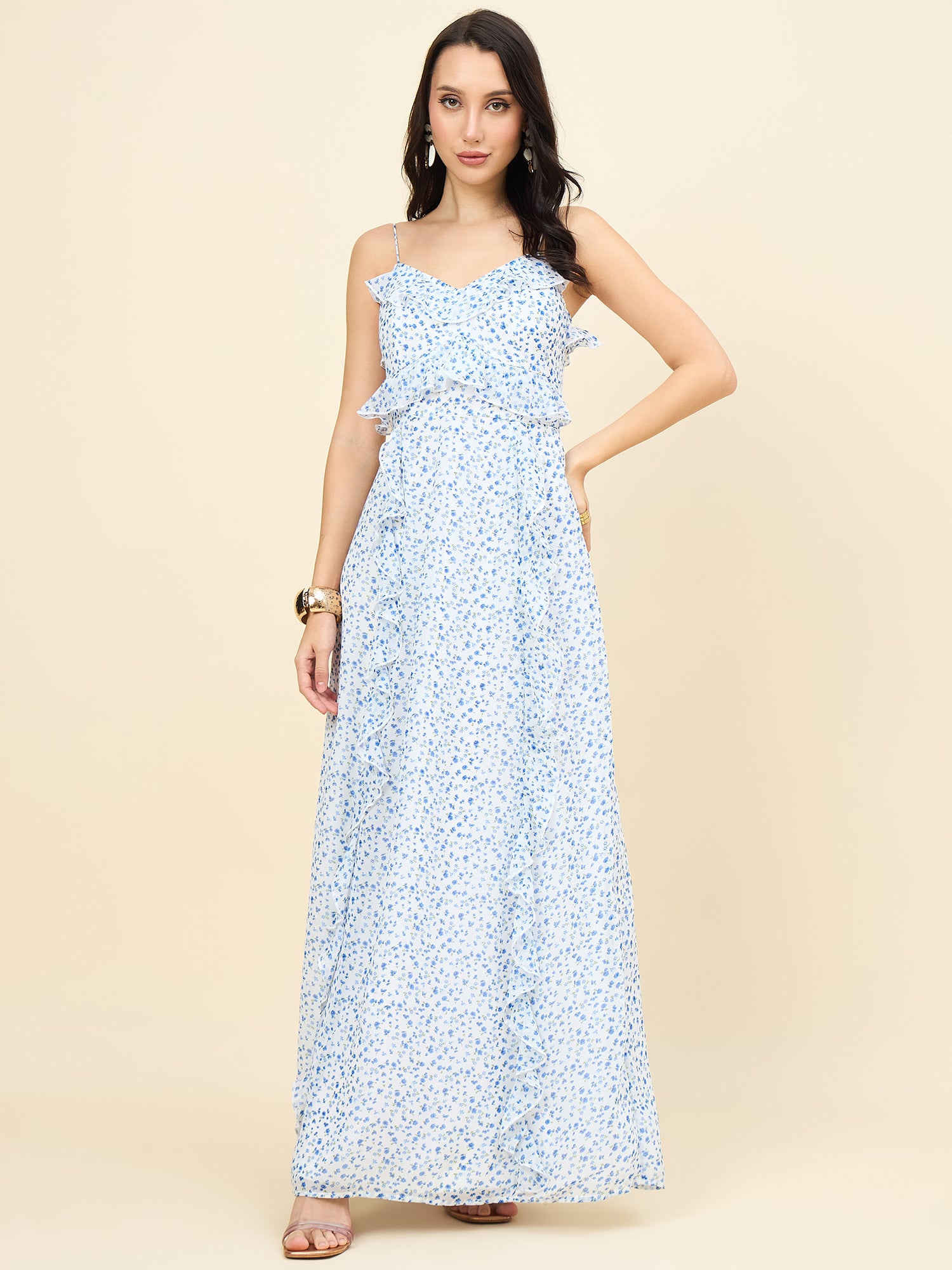 Woman wearing a light blue floral dress on a beige background