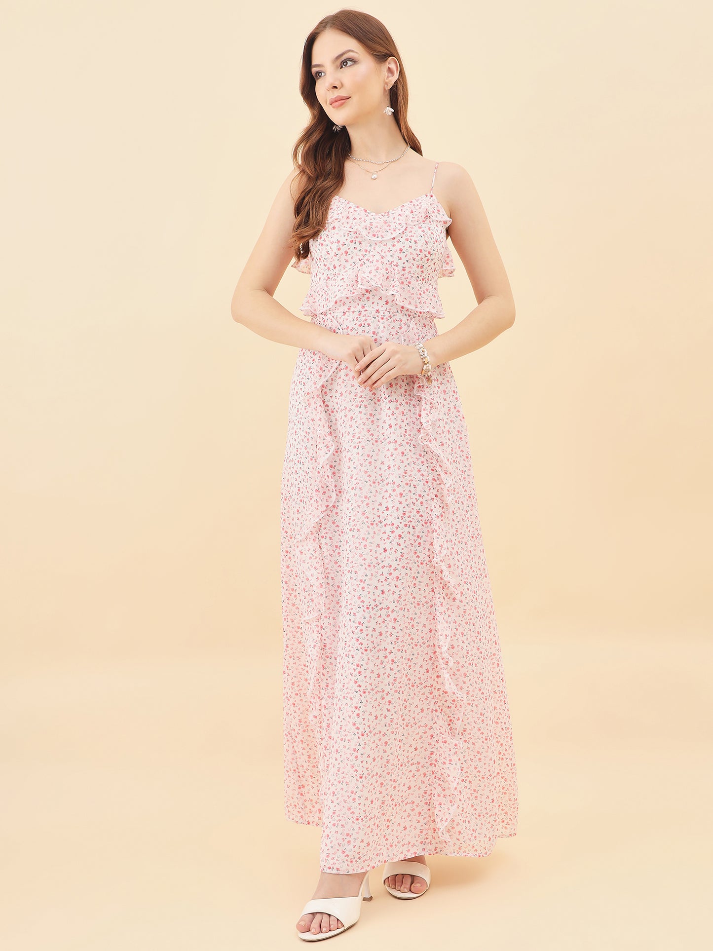 Woman wearing a floral dress on a beige background