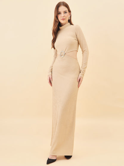 Woman wearing a beige long-sleeve dress with a belt on a beige background