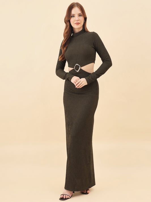 Woman wearing a long dark green dress with a cutout design on a beige background