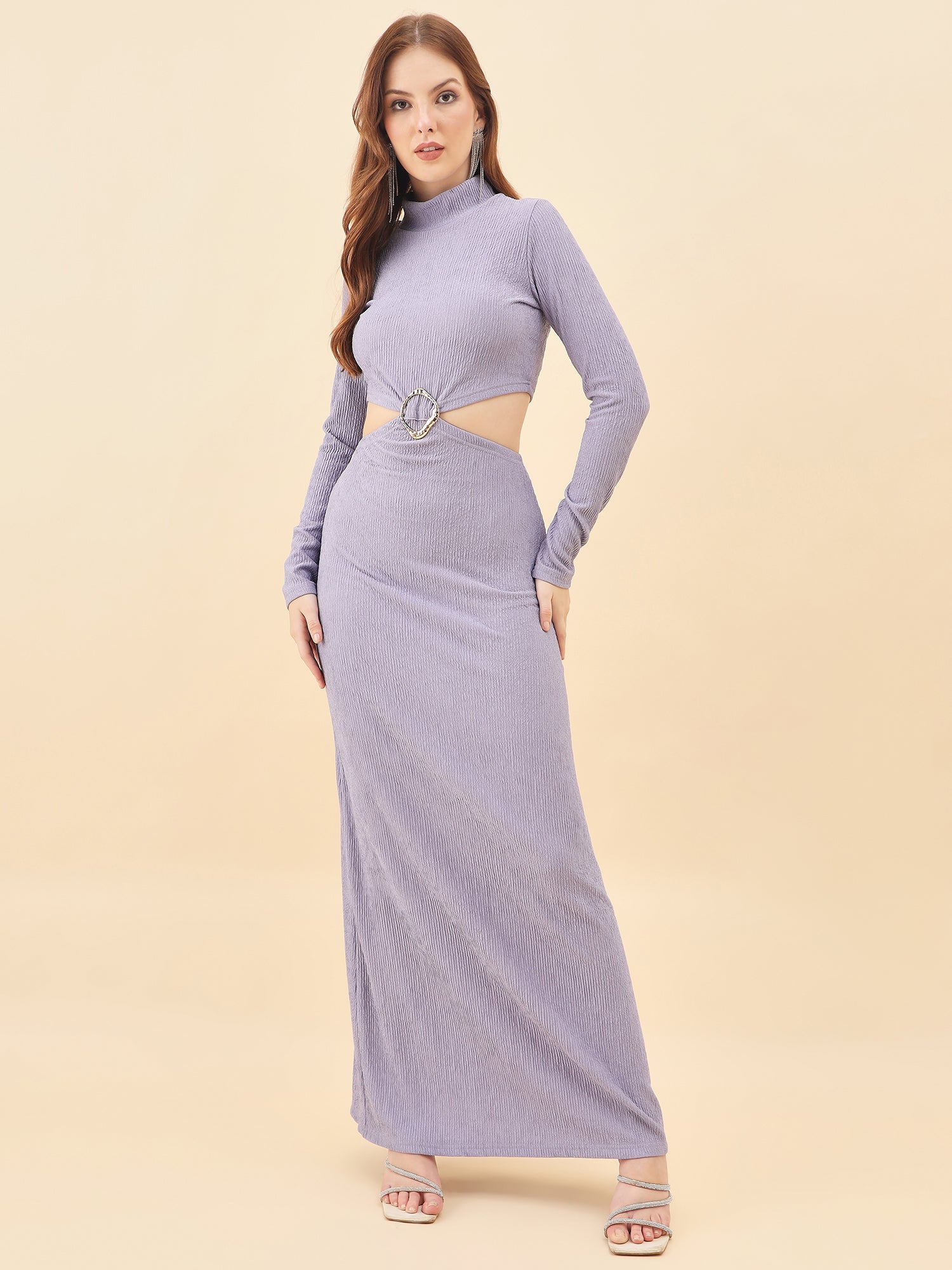 Woman wearing a long purple dress with a cutout design on a beige background