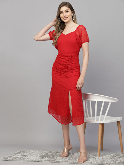 A woman modeling a sleeveless, square neckline, A-line Red dress with a split design on the skirt.