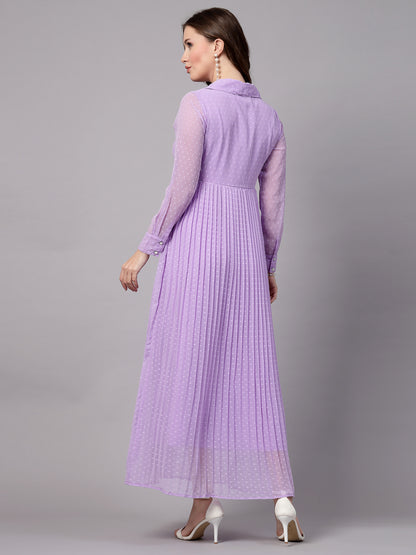 A woman wearing a fit and flare lavender dress with long sleeves and a V-neckline.