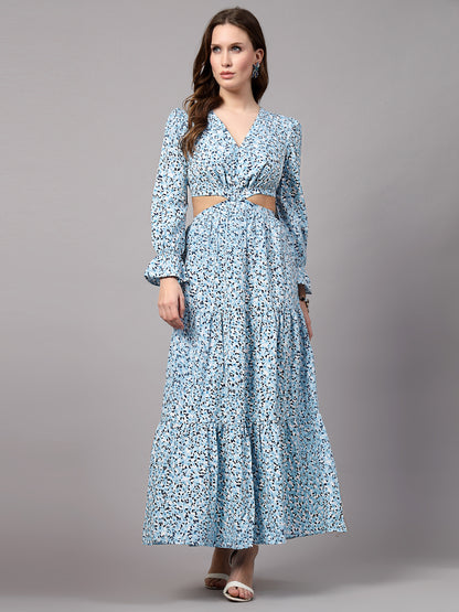 A woman wearing a light blue fit & flare dress with long sleeves and a V-neck neckline.