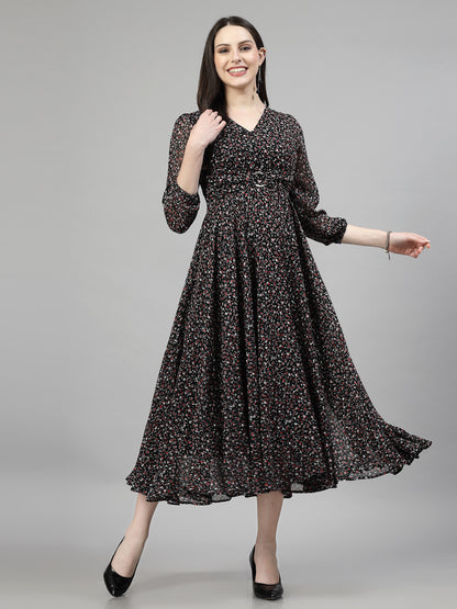 A woman modeling a floral printed, fit and flare dress with puff sleeves.