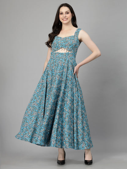 A woman wearing a fit and flare skyblue dress with floral patterns, sleeveless with a square neckline.