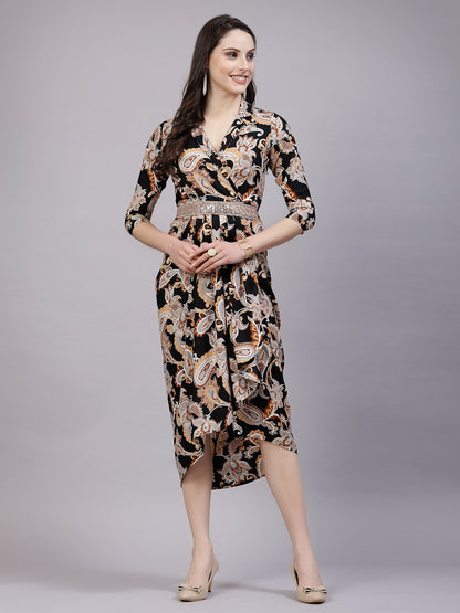 A woman standing and posing in a floral print midi dress with a collar and dhoti strap.